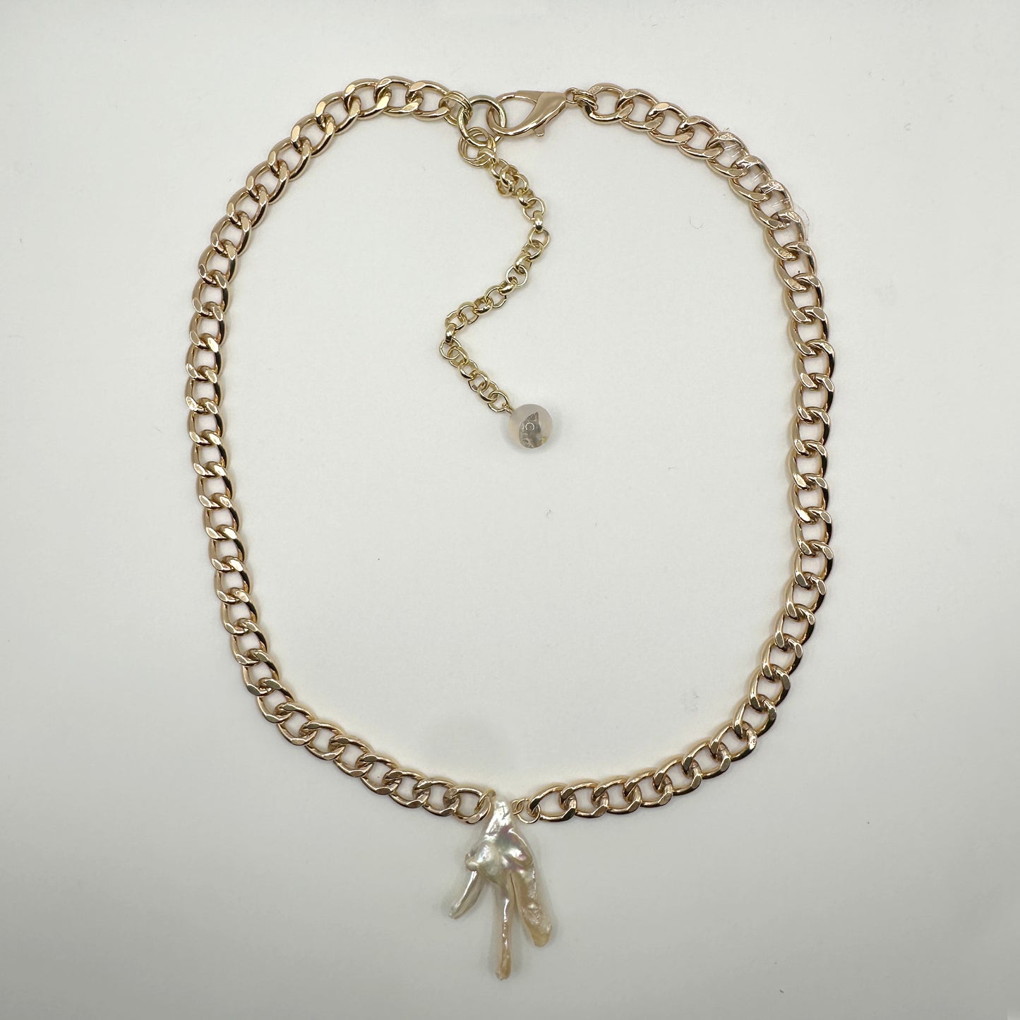 gold thick chain with birdfoot pearl